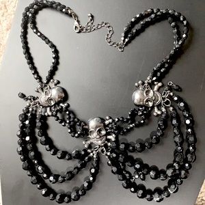 Black skull draped necklace